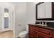 Bathroom showcasing a dark wood vanity with granite countertop, a sink, and a toilet at 2110 E Kerry Ln, Phoenix, AZ 85024