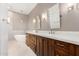 Bathroom featuring an elegant vanity with white countertops and fixtures plus a soaking tub at 2110 E Kerry Ln, Phoenix, AZ 85024