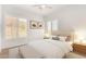 Stylishly staged bedroom showcases a plush bed, shuttered windows, and complementary decor for a tranquil retreat at 2110 E Kerry Ln, Phoenix, AZ 85024