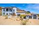 Stunning two-story home with a circular tower, tile roof, and a multi-car garage set against a mountain backdrop at 2110 E Kerry Ln, Phoenix, AZ 85024