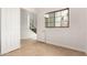 Hallway featuring tiled floors, white walls, and a view of the staircase at 2110 E Kerry Ln, Phoenix, AZ 85024