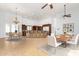 Open-concept kitchen with dark wood cabinetry, an island with bar seating, and tile flooring at 2110 E Kerry Ln, Phoenix, AZ 85024
