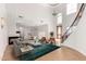 Bright, expansive living room with high ceilings, fireplace, open layout, and staircase at 2110 E Kerry Ln, Phoenix, AZ 85024