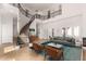 Elegant living room features a grand staircase, high ceilings, and stylish furniture at 2110 E Kerry Ln, Phoenix, AZ 85024