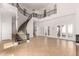 Spacious living room featuring a grand staircase, soaring ceilings, and ample natural light at 2110 E Kerry Ln, Phoenix, AZ 85024