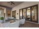 Inviting patio with brick flooring, ceiling fan and multiple entry points at 2110 E Kerry Ln, Phoenix, AZ 85024