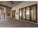 Spacious patio with brick flooring and multiple entry points from the house at 2110 E Kerry Ln, Phoenix, AZ 85024