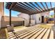 Pergola overlooking the house and landscaping, providing shade and outdoor living space at 2110 E Kerry Ln, Phoenix, AZ 85024