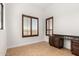 Bright room with granite-topped desk, tile floors, plantation shutters, and exterior views at 2110 E Kerry Ln, Phoenix, AZ 85024