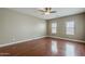 Bright bedroom with hardwood floors, and ample natural light from large windows at 2144 W Barwick Dr, Phoenix, AZ 85085