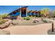 Exterior view of a community building with stunning architecture, water feature, landscaping, and a flag at 2144 W Barwick Dr, Phoenix, AZ 85085