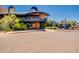 Exterior view of building with balcony overlooking desert landscaping and waterfall at 2144 W Barwick Dr, Phoenix, AZ 85085