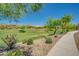 A large green space offers community members plenty of space for recreation and relaxation on a sunny day at 2144 W Barwick Dr, Phoenix, AZ 85085