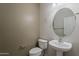 Neutral half bath featuring pedestal sink, chrome fixtures, and toilet at 2144 W Barwick Dr, Phoenix, AZ 85085