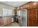 Kitchen featuring granite countertops, stainless steel appliances, and tiled flooring at 2144 W Barwick Dr, Phoenix, AZ 85085