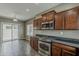 Kitchen area featuring stainless steel oven, microwave, and access to the patio at 2144 W Barwick Dr, Phoenix, AZ 85085