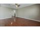 Spacious living room featuring gleaming hardwood floors, and ample natural light at 2144 W Barwick Dr, Phoenix, AZ 85085