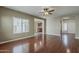 Spacious living room featuring gleaming hardwood floors, and ample natural light from many windows at 2144 W Barwick Dr, Phoenix, AZ 85085
