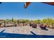 Spacious outdoor patio with comfortable seating and scenic views of lush landscaping and a playground at 2144 W Barwick Dr, Phoenix, AZ 85085