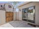 Enclosed patio featuring a sliding glass door and an outdoor gate at 2144 W Barwick Dr, Phoenix, AZ 85085