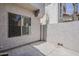 Relaxing outdoor patio area with a view of the stucco exterior at 2144 W Barwick Dr, Phoenix, AZ 85085
