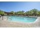 Community pool offers lap lanes, plenty of lounging, and a covered structure for shaded seating on a sunny day at 2144 W Barwick Dr, Phoenix, AZ 85085