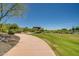 Community walking path offers exercise options and beautiful green views for neighborhood residents at 2144 W Barwick Dr, Phoenix, AZ 85085