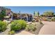 Stunning waterfall surrounded by lush greenery, creating a serene outdoor retreat at 2144 W Barwick Dr, Phoenix, AZ 85085