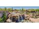 Scenic water feature with cascading waterfalls and lush landscaping at 2144 W Barwick Dr, Phoenix, AZ 85085