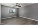 Bedroom with laminate floors, a window, and outlets at 2146 W Isabella Ave # 127, Mesa, AZ 85202