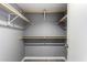 Walk-in closet with light grey walls and wood shelving at 2146 W Isabella Ave # 127, Mesa, AZ 85202