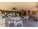 A well-maintained community area featuring tables, chairs, and ceiling fans at 2146 W Isabella Ave # 127, Mesa, AZ 85202