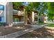 View of a condo building with stairs, landscaping, and a charming entrance at 2146 W Isabella Ave # 127, Mesa, AZ 85202