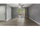Living room area with a ceiling fan and sliding door to patio at 2146 W Isabella Ave # 127, Mesa, AZ 85202