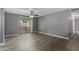 Spacious living room area with a ceiling fan and sliding door to patio at 2146 W Isabella Ave # 127, Mesa, AZ 85202