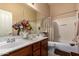 Bathroom featuring double sinks, shower-tub combo, and modern fixtures at 22026 N 44Th Pl, Phoenix, AZ 85050