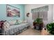 Cozy bedroom with southwestern decor, daybed, and Singer sewing machine desk at 22026 N 44Th Pl, Phoenix, AZ 85050