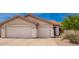 Charming single-story home with a two-car garage and low-maintenance desert landscaping at 22026 N 44Th Pl, Phoenix, AZ 85050