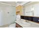 Well-lit bathroom with tiled shower and updated vanity at 2306 W Laurel Ln, Phoenix, AZ 85029