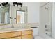 Bright bathroom featuring vanity and a shower-tub combo at 2306 W Laurel Ln, Phoenix, AZ 85029