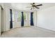 Open bedroom featuring a ceiling fan and a series of windows offering plenty of natural light at 2306 W Laurel Ln, Phoenix, AZ 85029