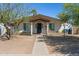 Charming single-story home with a covered porch and desert landscaping, perfect for curb appeal at 2306 W Laurel Ln, Phoenix, AZ 85029