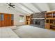 Spacious living room with a brick fireplace, vaulted ceilings, and carpet flooring at 2306 W Laurel Ln, Phoenix, AZ 85029