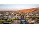 Expansive aerial view showcasing the community's homes with lush landscaping, contrasted by the desert backdrop at 2335 E Allen St, Phoenix, AZ 85042