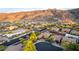 Picturesque aerial view of luxury homes and desert landscaping set against a backdrop of rugged mountains at 2335 E Allen St, Phoenix, AZ 85042