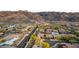 Scenic aerial view of homes, tree-lined streets, and rugged mountain landscapes offering a serene lifestyle at 2335 E Allen St, Phoenix, AZ 85042