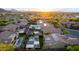 Breathtaking aerial shot of a neighborhood with stunning mountain views, highlighting private pools and desert landscaping at 2335 E Allen St, Phoenix, AZ 85042