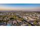 Expansive aerial view showcasing a residential area with desert landscaping and stunning mountain vistas at sunset at 2335 E Allen St, Phoenix, AZ 85042