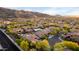 Scenic aerial view of desert homes nestled amongst mature trees with mountain views, showcasing neighborhood charm at 2335 E Allen St, Phoenix, AZ 85042