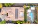 Stunning aerial view of home with solar panels, pristine pool, and lush landscaping, perfect for luxury living at 2335 E Allen St, Phoenix, AZ 85042